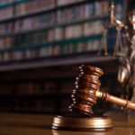 Gavel and Themis statue in the court library.