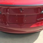 model-3-performance-spoiler-badge-1-1-e1532025493910