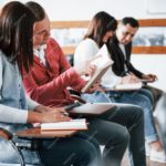 active-conversation-group-of-people-at-business-conference-in-modern-classroom-at-daytime_146671-16259